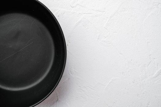 Empty black bowl set, with copy space for text or food, with copy space for text or food, top view flat lay, on white stone table background