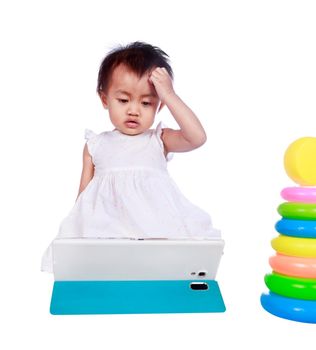 baby playing with digital tablet isolated on a white background