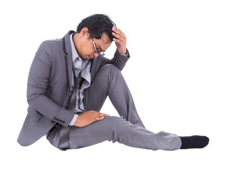 stressed businessman touching his head and thinking isolated on white background