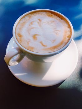 Cappuccino in summer cafe outdoors.