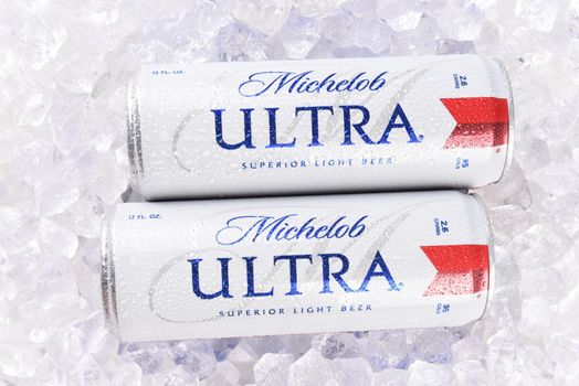 IRVINE, CA - AUGUST 6, 2018: Two Michelob Ultra beer 12 ounce cans in ice. A a low carb and low calorie light beer from Anheuser-Busch. 