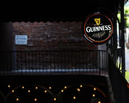 LOS ANGELES, CALIFORNIA - FEBRUARY 2, 2014: Guinness Sign Outside Drinking Establishment. Guinness is the World's Most Iconic Beer, brewed In Dublin Since 1759.