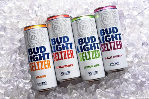 IRIVNE, CALIFORNIA - 2 JULY 2021: Bud Light Seltzer. Four cans, Lemon Lime, Mango, Strawberry and Black Cherry flavors in a bed of ice. 