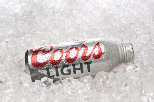 IRVINE, CALIFORNIA - APRIL 15, 22019: A Coors Light Aluminum Pint Bottle laying in a bed of ice. 