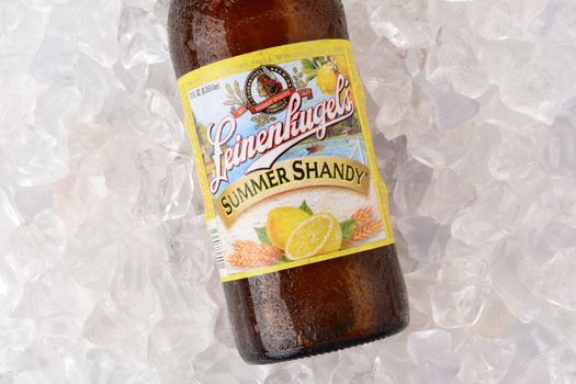 IRVINE, CA - JUNE 2, 2015: A bottle of Leinenkugel Summer Shandy on a bed of ice. Leinenkugel was founded in Chippewa Falls, WI, in 1867 by Jacob Leinenkugel.