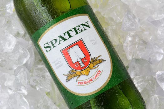 IRVINE, CA - JANUARY 11, 2015: A bottle of Spaten Lager on a bed of ice. The Spaten-Franziskaner-Brau GmbH is a brewery in Munich, Germany.