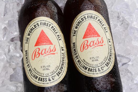 IRVINE, CA - MAY 25, 2014: Two bottles of Bass Ale on a bed of ice. The Bass Brewery was founded in 1777 by William Bass, in Trent, England is now owned by Anheuser-Busch InBev.