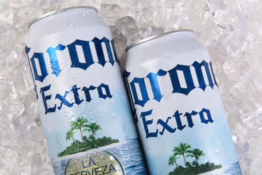 IRVINE, CALIFORNIA - MARCH 21, 2018: A 24 ounce can of Corona Extra on ice closeup. Corona Extra is a pale lager produced by Cerveceria Modelo in Mexico for domestic distribution and export.