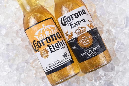 IRVINE, CALIFORNIA - DECEMBER 15, 2017: Two bottles of Corona Extra and Light Beer on ice. Corona is the most popular imported beer in the USA.