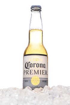 IRVINE, CALIFORNIA - MARCH 21, 2018:  A bottle of Corona Premier in ice. Corona Premier is premium light beer with 2.6 grams of carbs and 90 calories.