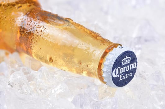 IRVINE, CALIFORNIA - DECEMBER 15, 2017: A bottle of Corona Extra Beer on ice. Corona is the most popular imported beer in the USA.