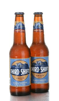 IRVINE, CA - June 26, 2014: Two bottles of Third Shift Amber Lager with condensation. Brewed by the Band of Brewers in Ft. Worth Texas, a division of the MillerCoors network.