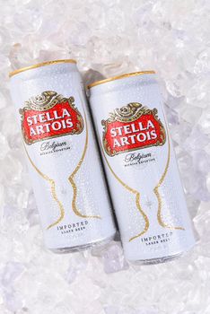 IRVINE, CA - JULY, 17, 2017: Cans of Stella Artois Beer closeup on Ice. Stella has been brewed in Leuven, Belgium, since 1926, and launched as a festive beer, named after the Christmas star.