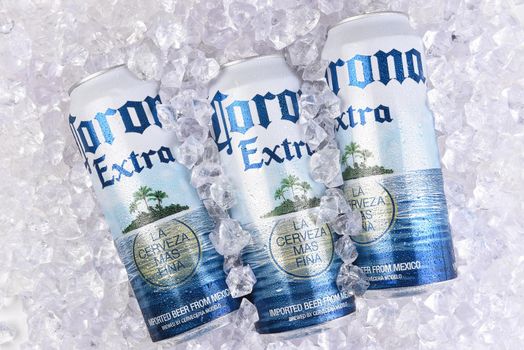IRVINE, CALIFORNIA - MARCH 29, 2018: Corona Extra beer king cans in ice. Corona is the most popular import in the USA.