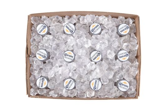 IRVINE, CALIFORNIA - 10 MAR 2020: High angle view of a 12 pack of Corona Premier bottles with ice cubs in the box.