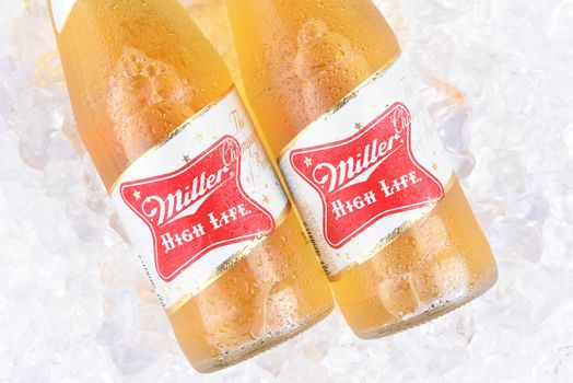 IRVINE, CA - APRIL 10, 2017: Miller High Life bottles on ice. High Life, a pilsner style beer, is Millers oldest brand entering the market in 1903
