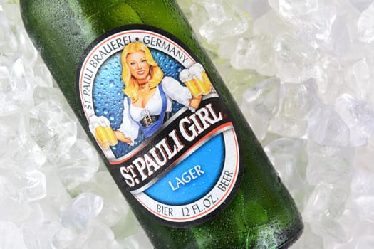 IRVINE, CA - JANUARY 12, 2015: A bottle of St. Pauli Girl Beer on a bed of ice. The brand gets its name for it original location, next to St. Paul's Monastery in Bremen. It's now Brewed at the Beck's facility.