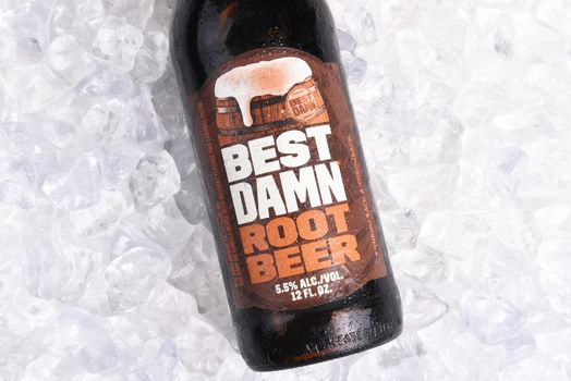 IRVINE, CALIFORNIA - JANUARY 22, 2017: Best Damn Root Beer bottle on ice. The Hard Root Beer contains 5.5% alcohol. They also brew Hard Apple Ale and Cherry Cola.