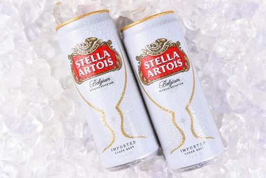 IRVINE, CA - JULY, 17, 2017: Cans of Stella Artois Beer closeup on Ice. Stella has been brewed in Leuven, Belgium, since 1926, and launched as a festive beer, named after the Christmas star.