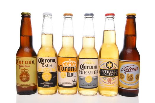 IRVINE, CALIFORNIA - APRIL 5, 2018: Six bottles of Mexican Import beers. Brands include Corona Extra, Light Premier, Familiar and Victoria and Estrella Jalisco.