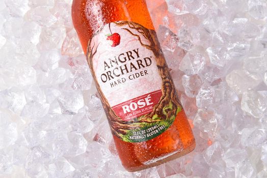 IRVINE, CALIFORNIA - OCTOBER 19, 2018: Angry Orchard Rose Hard Cider closeup on a bed of ice. Made with rare French Red Flesh Apples..