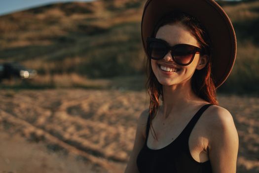 woman in sunglasses near car travel summer vacation landscape. High quality photo