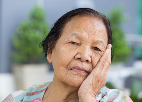 Close up of senior woman with worried stressed face 