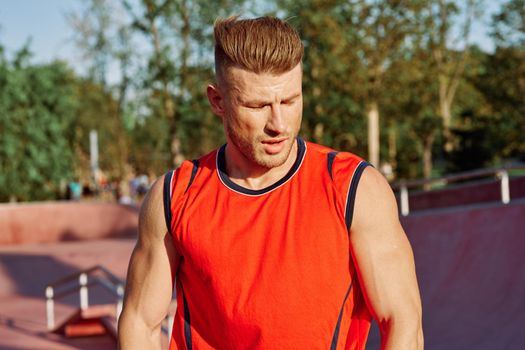 sports man on the playground in the park workout. High quality photo