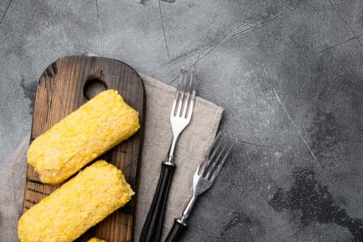 Breaded chicken cutlet set, on gray stone table background, top view flat lay, with copy space for text