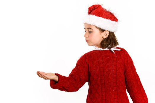 Adorable little girl wearing santa hat isolated on white background. Winter clothes for Christmas