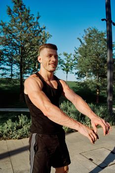 sporty man exercise fitness workout outdoors with dumbbells. High quality photo