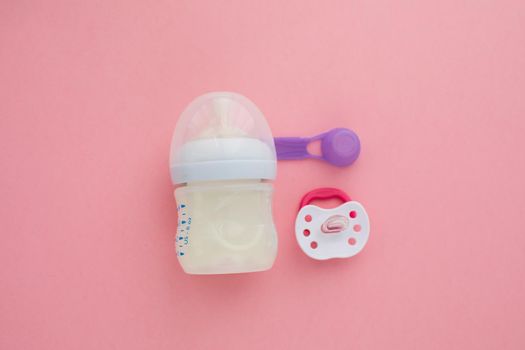 preparation of mixture baby feeding on pink background top view
