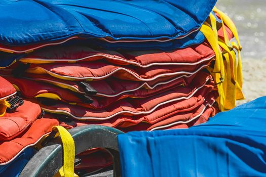 Life jackets, protection and safety of life on the water against the background of the sea.