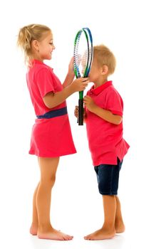 Two cheerful children, a boy and a girl, brother and sister, stand together and hold a badminton racket. Isolated on white background.