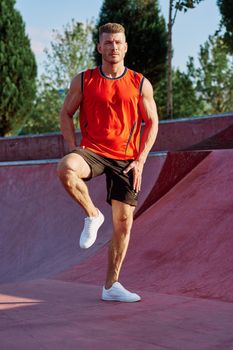 sports man on the playground in the park workout. High quality photo