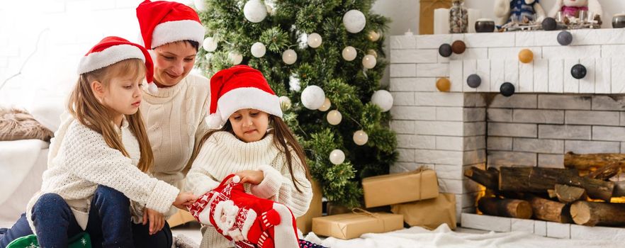 two little girls Sharing a Surprise on Christmas Morning.