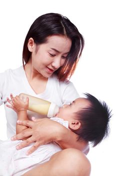 Mother feeding baby daughter isolated on a white background