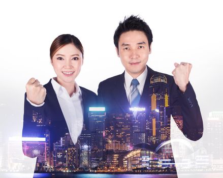 double exposure of successful business man and woman with arm raised with a city background