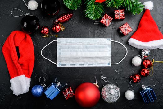 Coronavirus and Christmas celebration concept set, on black dark stone table background, top view flat lay