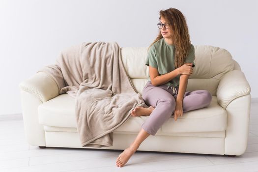 Coronavirus, Covid-19, Quarantine, isolation, coronavirus pandemic world. Stay at home. Bored woman spending time sitting on sofa at home