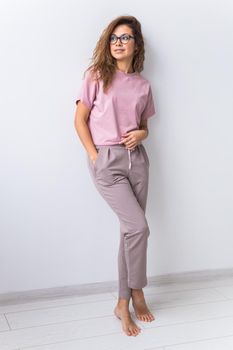 Warm pink kit for sleeping. Soft cotton t-shirt and pants. Comfortable clothes for healthy sleep. Pajamas concept