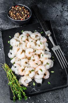 Peeled Shrimps, Prawns on a marble board. Black background. top view.