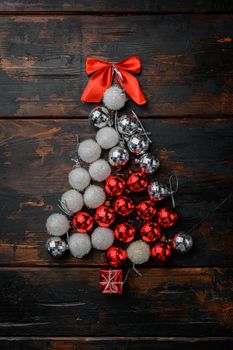 Christmas tree from toys concept set, on old dark wooden table background, top view flat lay