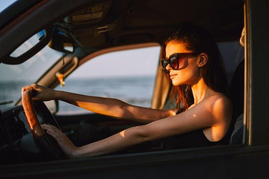 woman driving in car trip posing fashion travel. High quality photo