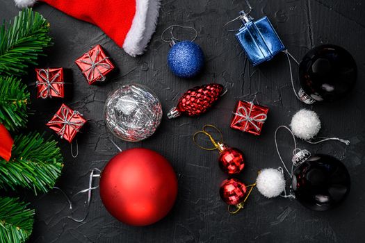 Christmas composition for gift postcard set, top view flat lay, on black dark stone table background