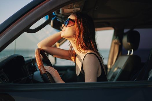 woman driving in car trip posing fashion travel. High quality photo