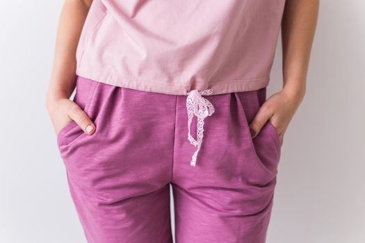 Warm pink kit for sleeping. Soft cotton t-shirt and pants. Comfortable clothes for healthy sleep. Pajamas concept