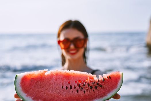 cheerful pretty woman in black swimsuit watermelon fashion travel. High quality photo