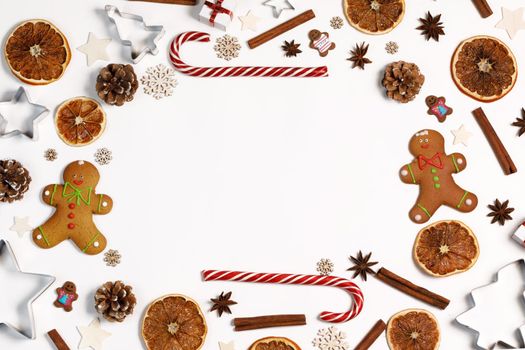 Christmas food frame isolated on white background dry orange gingerbread cookies candy canes