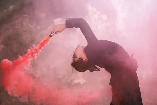 Pasadoble, latin solo dance and contemporary dance - Young beautiful female dancing into smoke cloud.